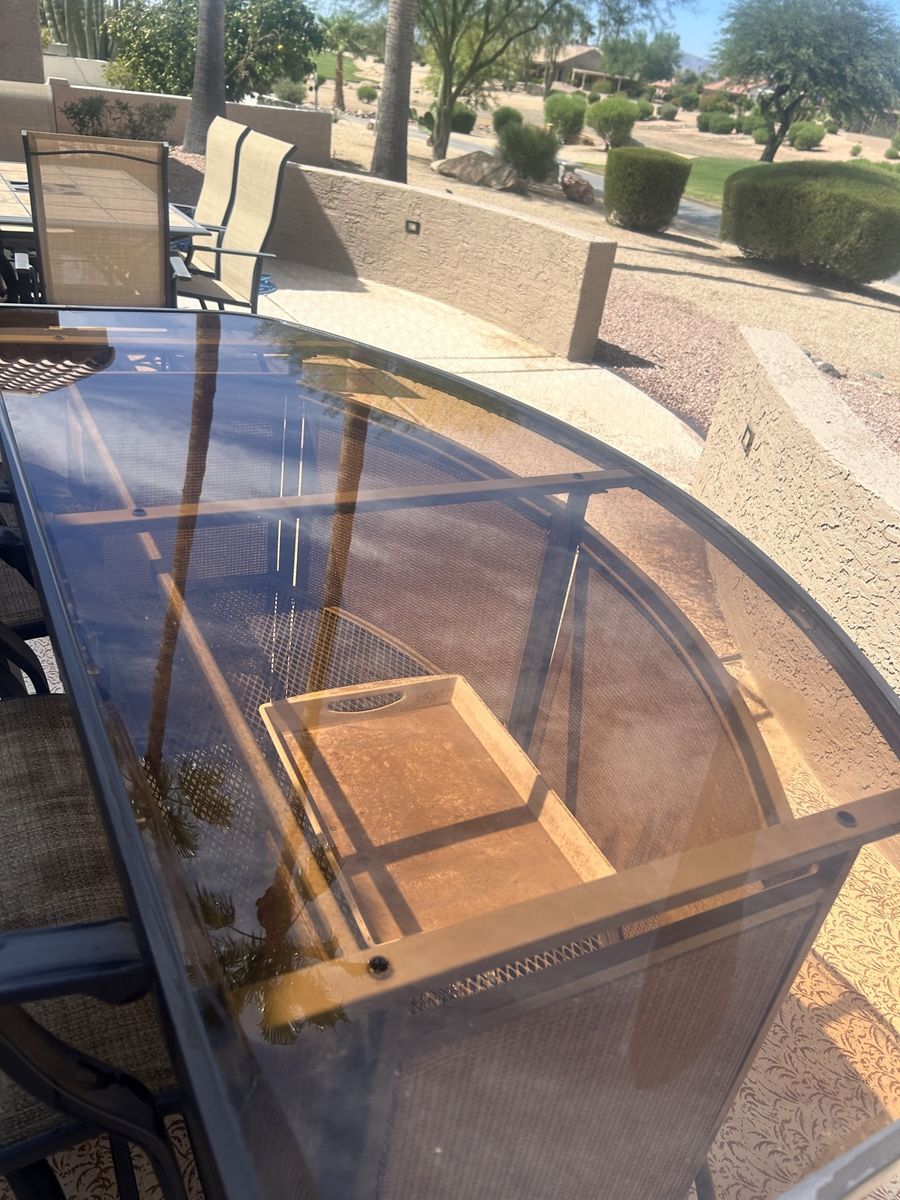 Dirty patio glass table after cleaning by Clear as Days