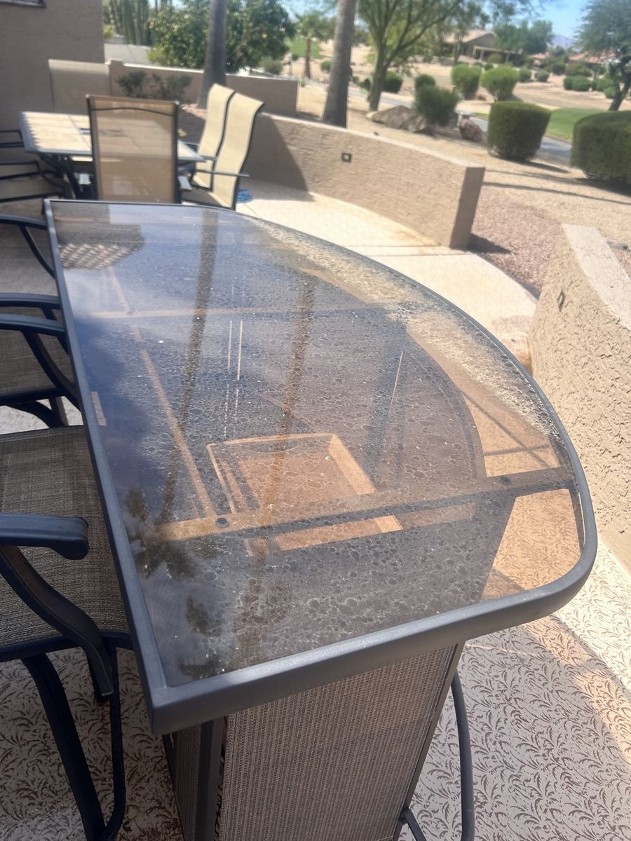 Dirty patio glass table before cleaning