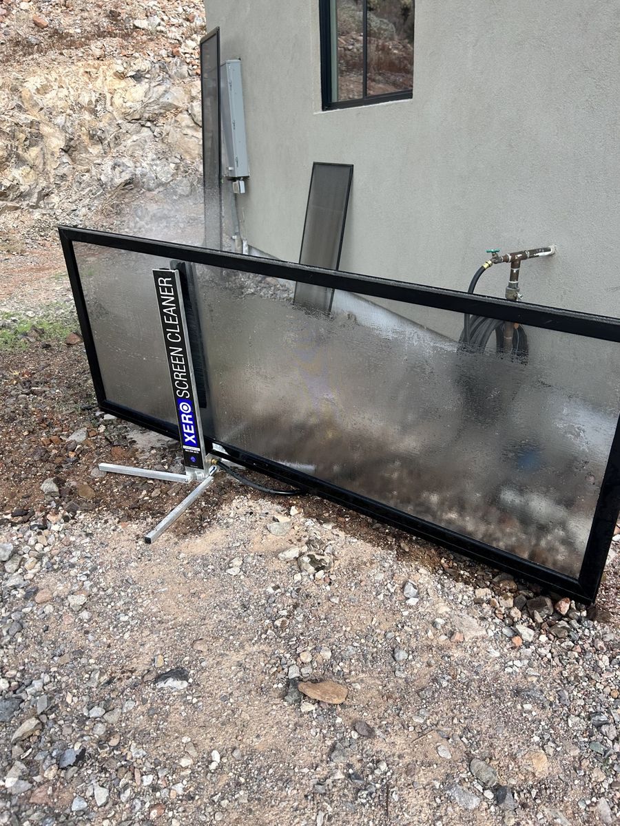 Xero screen cleaner washing a window screen