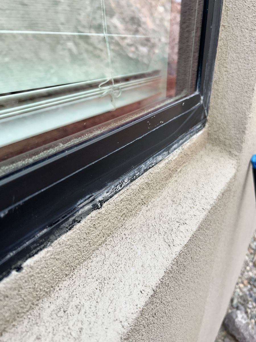 Dirty window sill and frame before cleaning