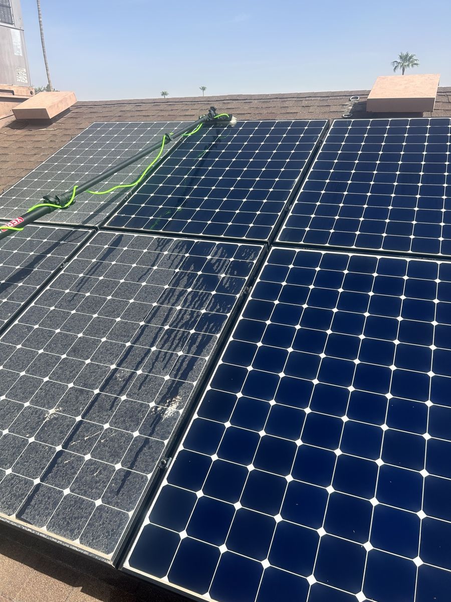 Solar panels half cleaned showing dramatic before and after