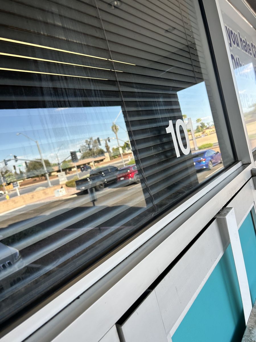 Dirty commercial storefront window after cleaning by Clear as Days