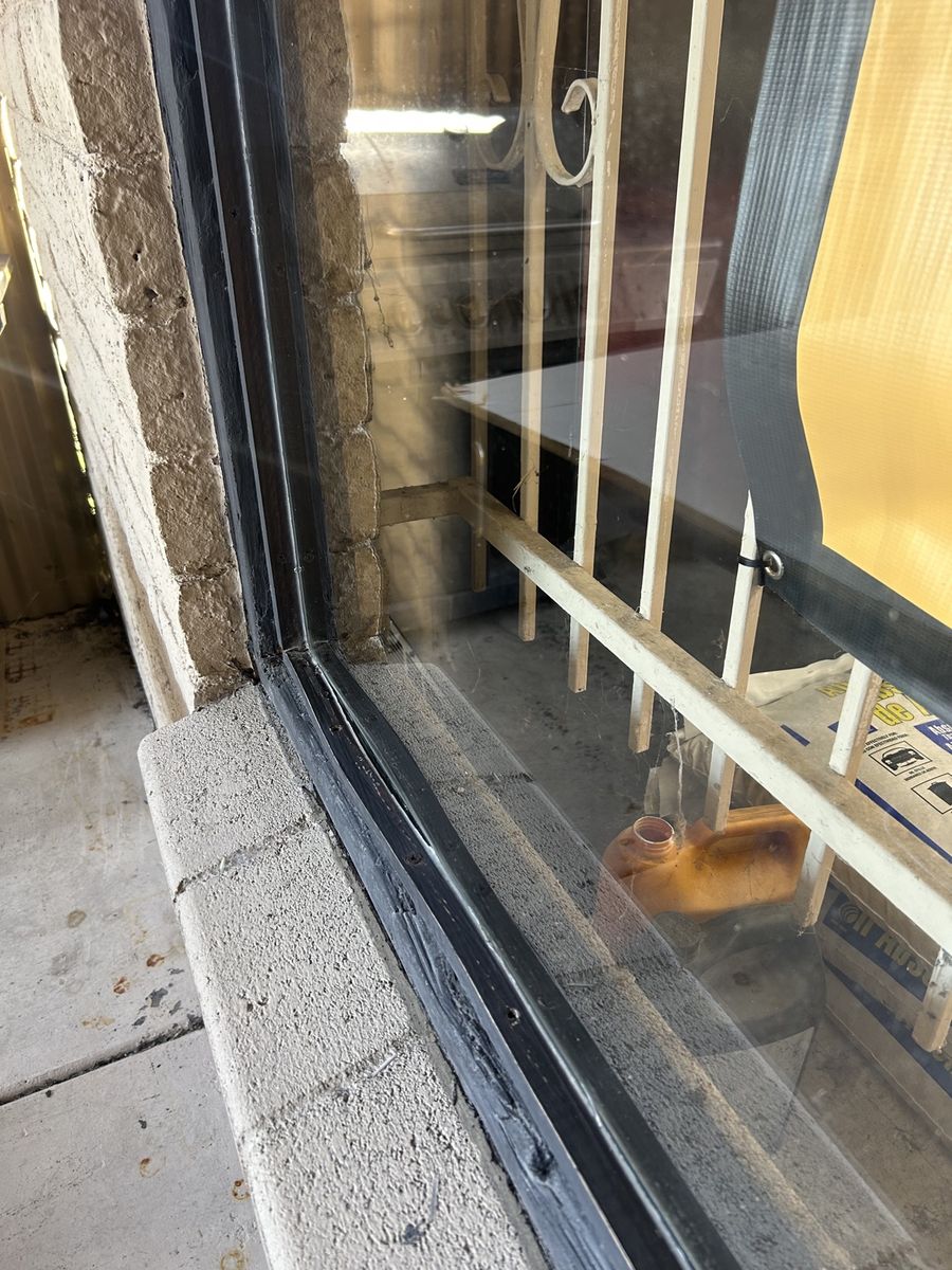 Water-spotted storefront glass after cleaning by Clear as Days